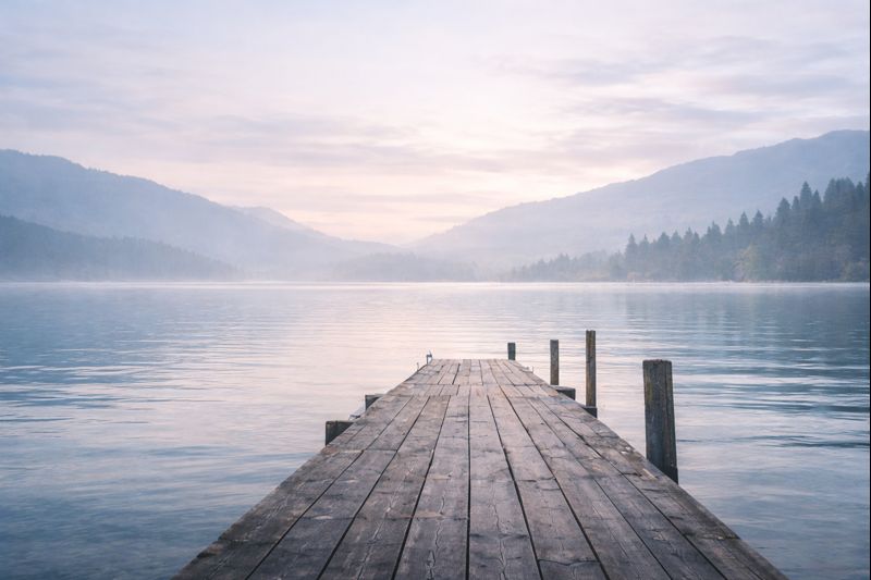 Serene lake with wooden dock